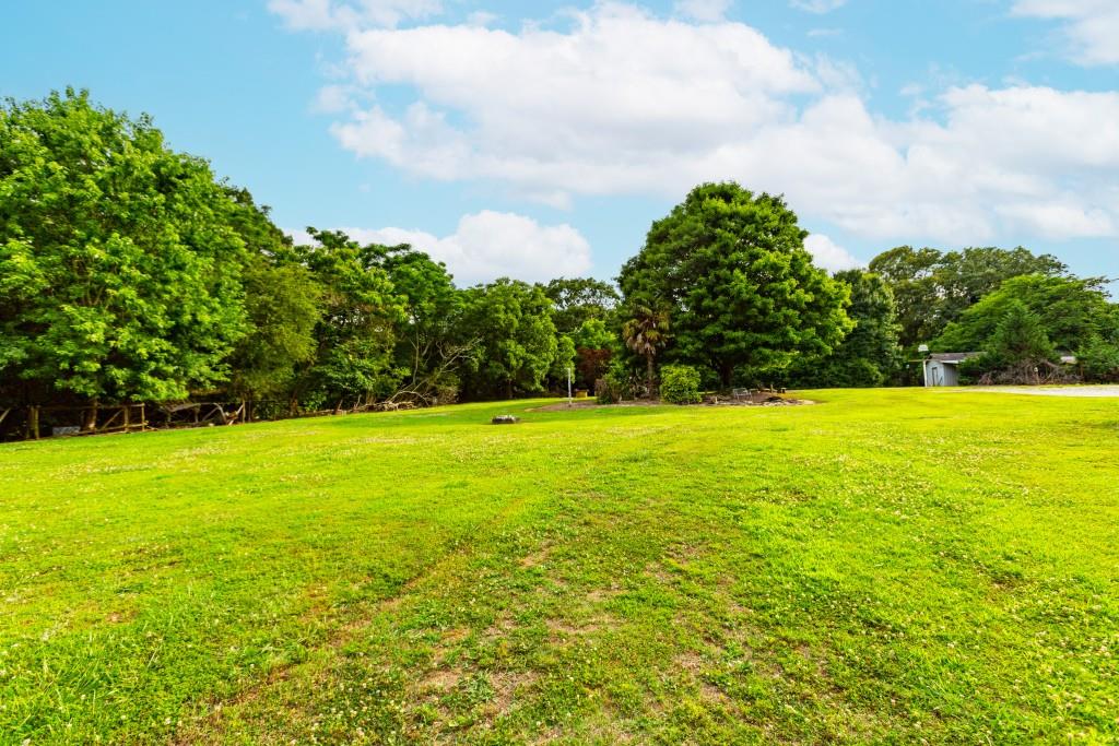 1042 Harbins Road Dacula, GA 30019 - Photo 28 of 33 a view of an ocean and a yard