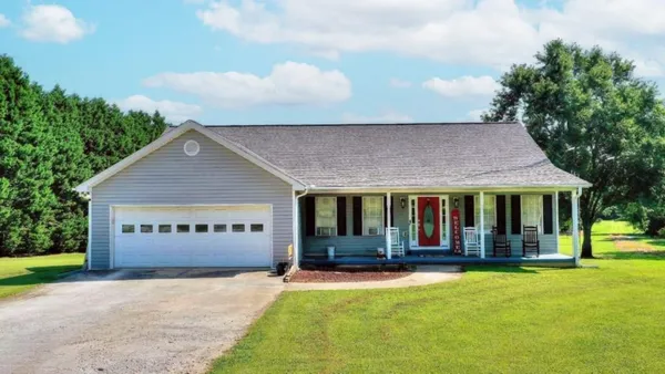 front view of a house with a yard