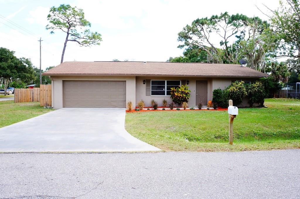 235 Unicorn Road Venice, FL 34293 - Photo 1 of 1 a front view of a house with a yard and garage