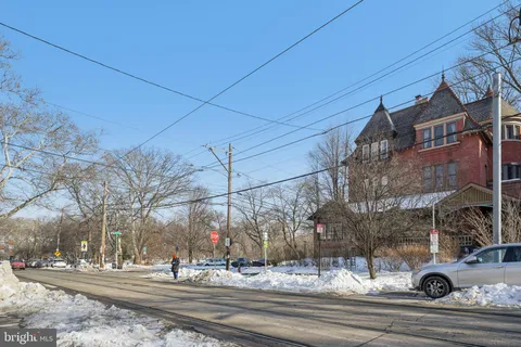 a view of a road with a building in the background