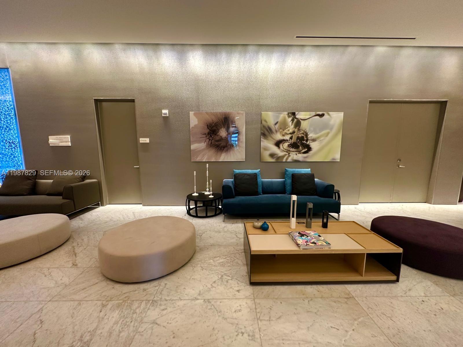 88 Southwest 7th Street, Unit 3609 Miami, FL 33130 - Photo 11 of 25 a living room with furniture and a lamp