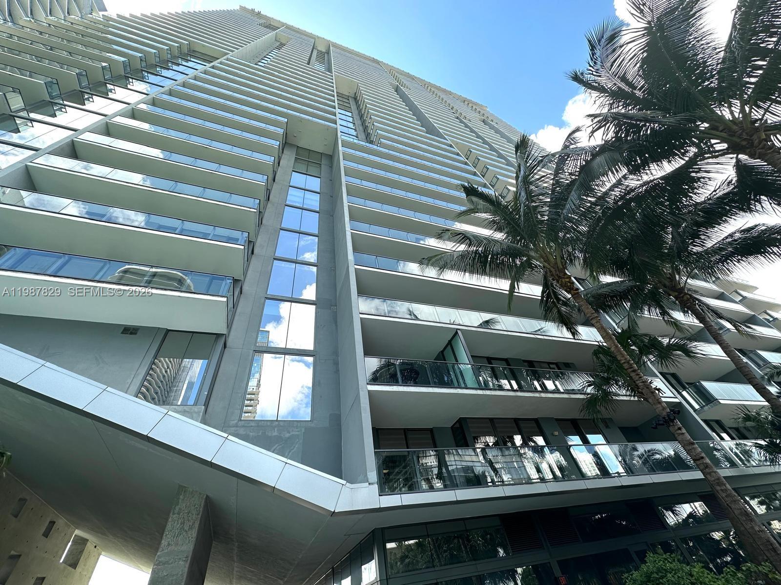 88 Southwest 7th Street, Unit 3609 Miami, FL 33130 - Photo 25 of 25 a view of tall building from a balcony