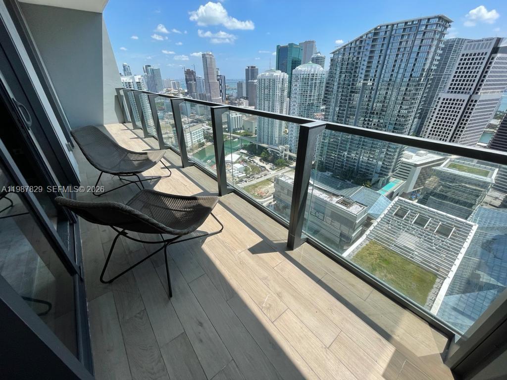 88 Southwest 7th Street, Unit 3609 Miami, FL 33130 - Photo 9 of 25 a view of balcony with furniture