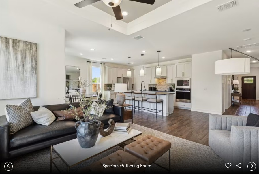16813 Bustillos Path Manor Manor, TX 78653 - Photo 8 of 15 a living room with furniture kitchen view and a chandelier