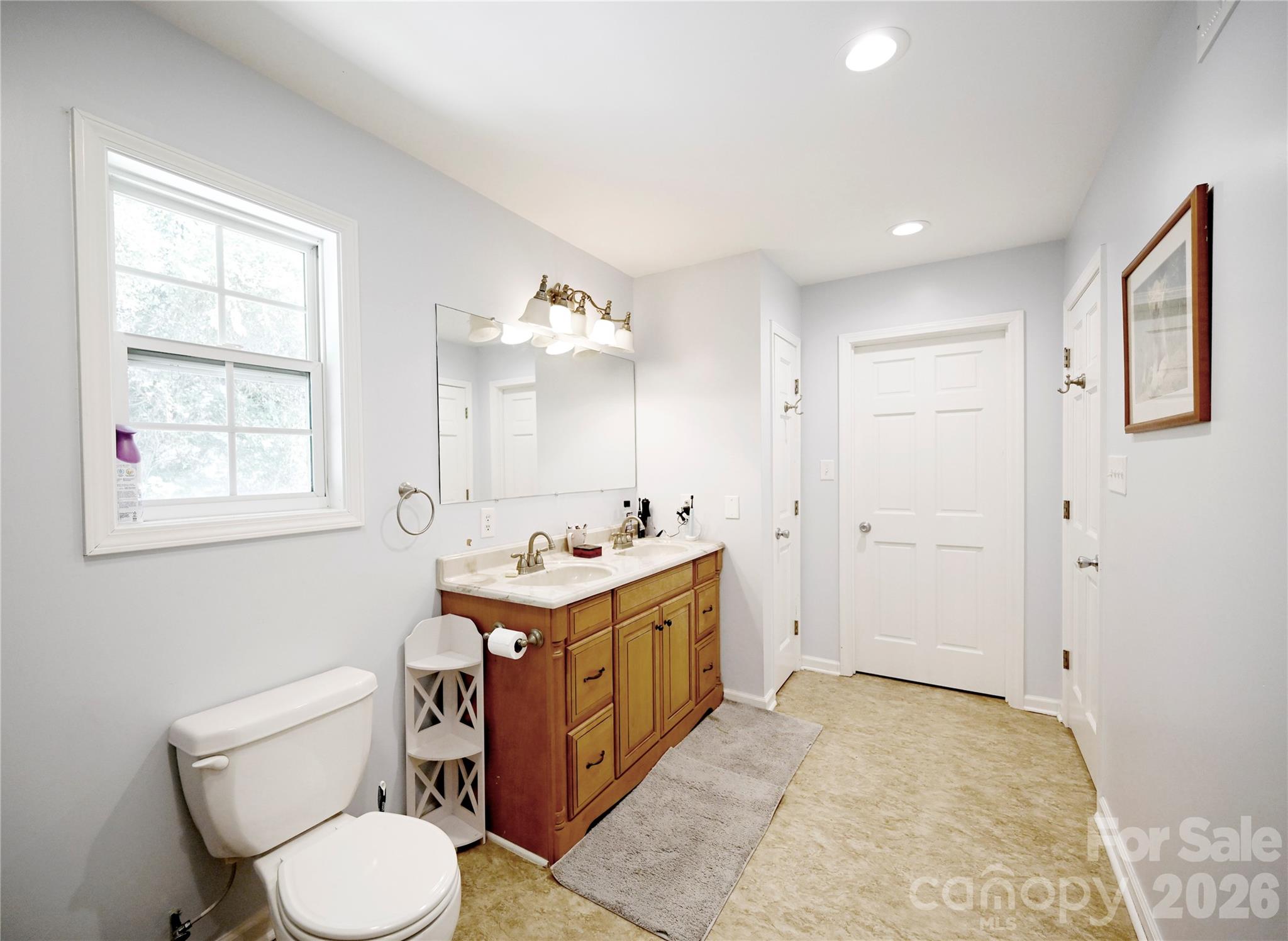 1845 State Rd S-46-149 Clover, SC 29710 - Photo 17 of 28 a bathroom with a toilet sink and mirror