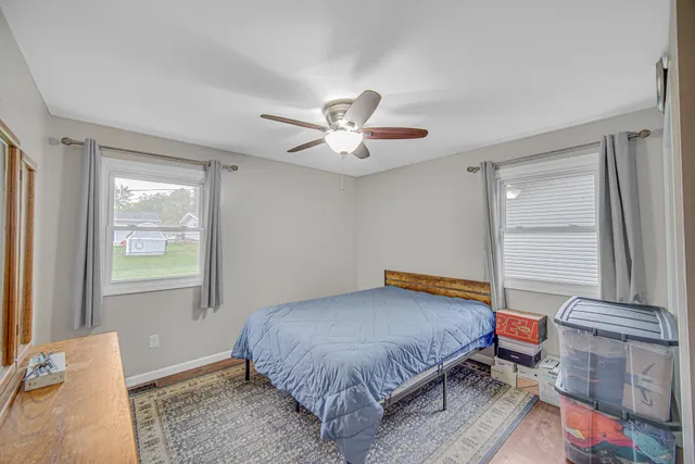 a bedroom with a bed and window