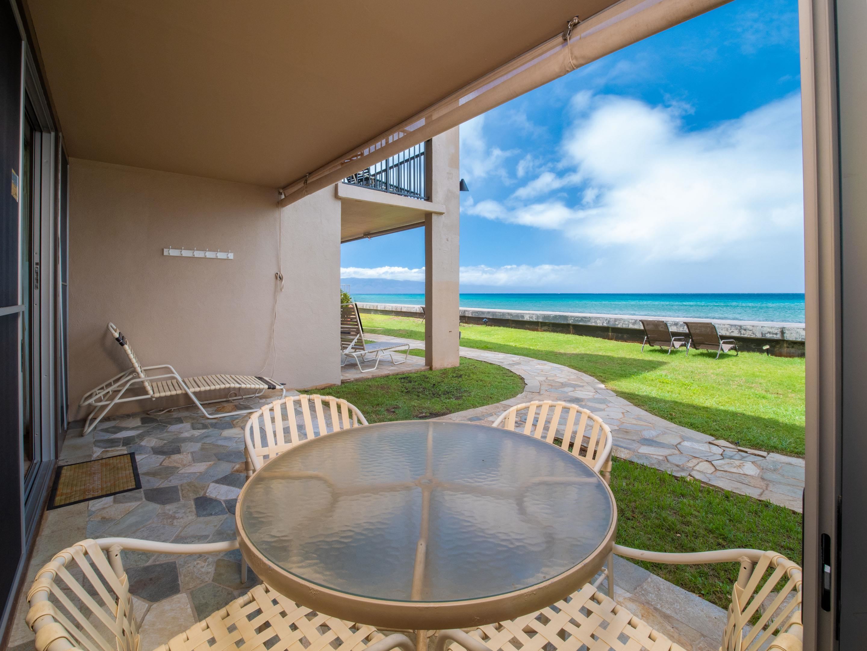 3723 Lower Honoapiilani Road, Unit 104 Lahaina, HI 96761 - Photo 17 of 45 a view of a swimming pool with a lounge chairs