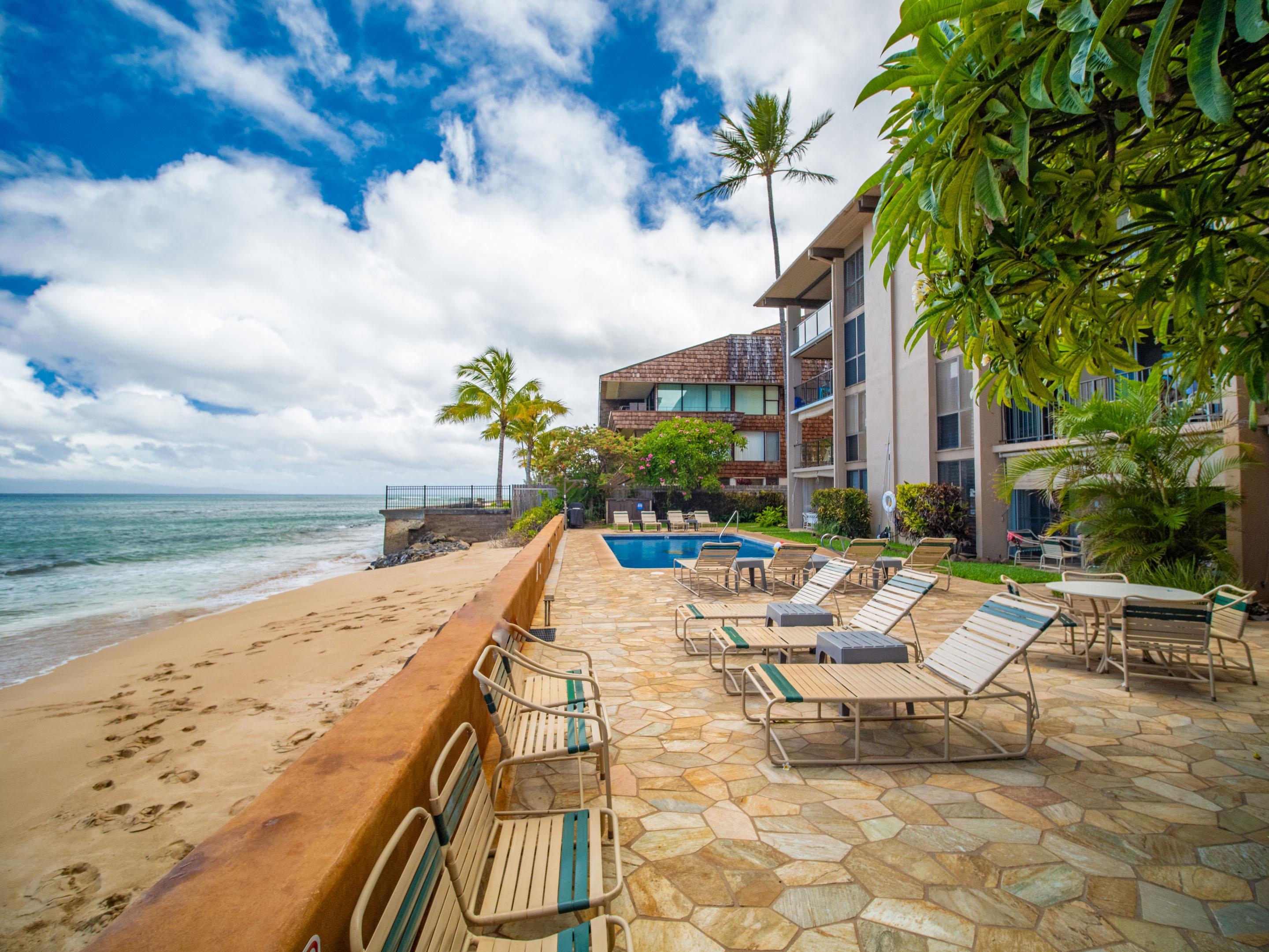 3723 Lower Honoapiilani Road, Unit 104 Lahaina, HI 96761 - Photo 28 of 45 a view of swimming pool with outdoor seating and plants