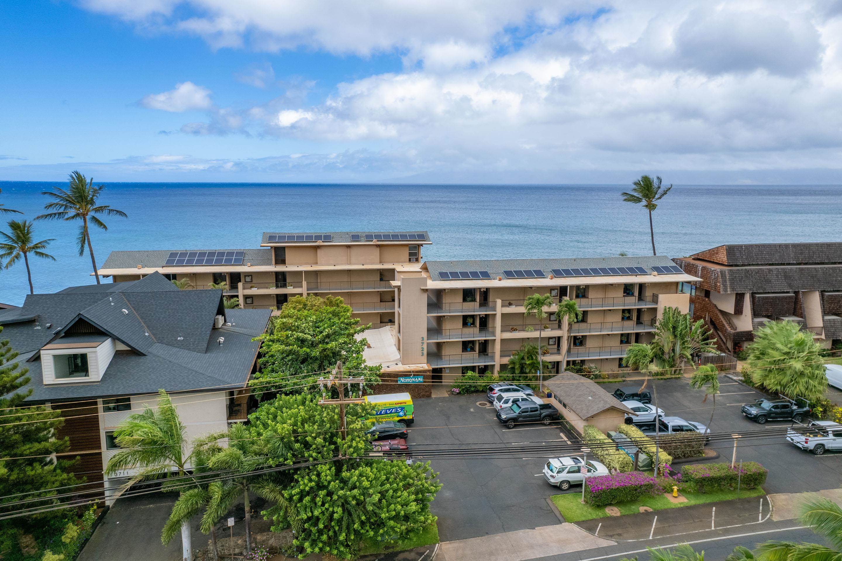 3723 Lower Honoapiilani Road, Unit 104 Lahaina, HI 96761 - Photo 32 of 45 a front view of a house with garden