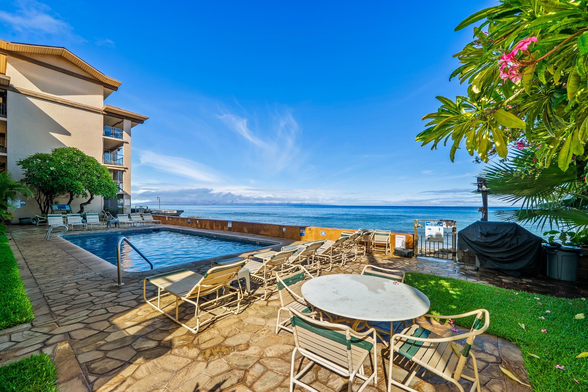 3723 Lower Honoapiilani Road, Unit 104 Lahaina, HI 96761 - Photo 36 of 45 a view of a swimming pool with a patio