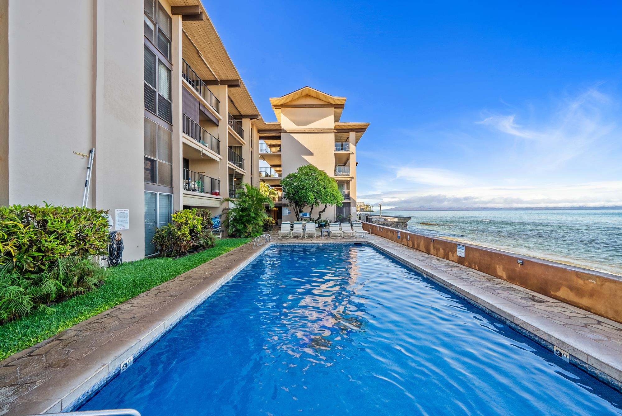 3723 Lower Honoapiilani Road, Unit 104 Lahaina, HI 96761 - Photo 41 of 45 a view of building with yard and ocean view