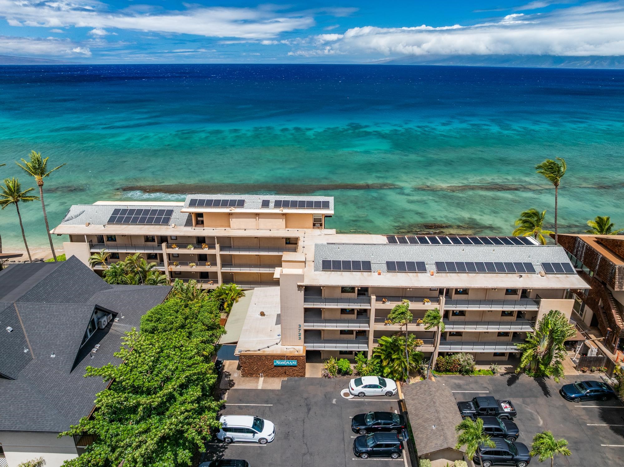3723 Lower Honoapiilani Road, Unit 104 Lahaina, HI 96761 - Photo 44 of 45 an aerial view of a house with a yard pool outdoor seating and yard