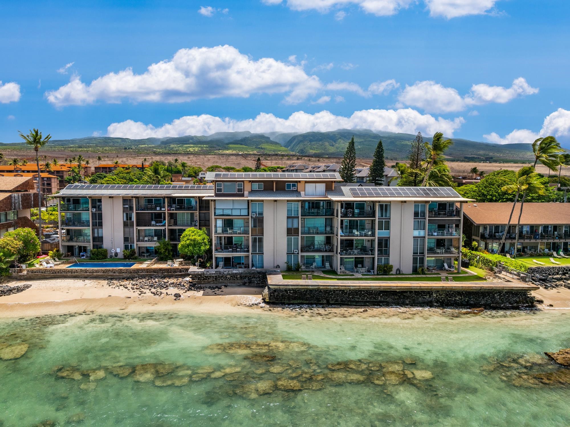 3723 Lower Honoapiilani Road, Unit 104 Lahaina, HI 96761 - Photo 45 of 45 a front view of a house with a yard