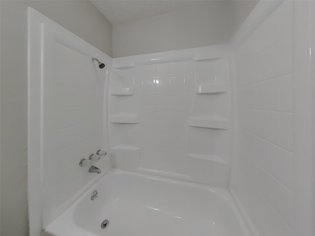 4227 Burkegate Drive Spring, TX 77373 - Photo 14 of 15 a bathroom with a bathtub