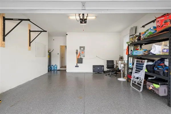 a view of a livingroom with toys and a ceiling fan