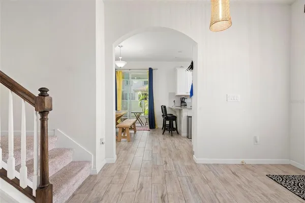 a view of a livingroom with furniture and hardwood floor