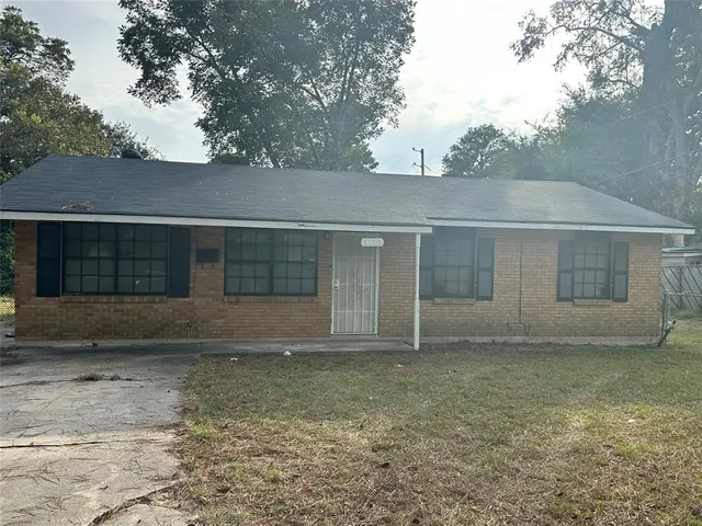 front view of a house and a yard
