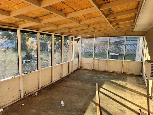 a view of an empty room with a balcony