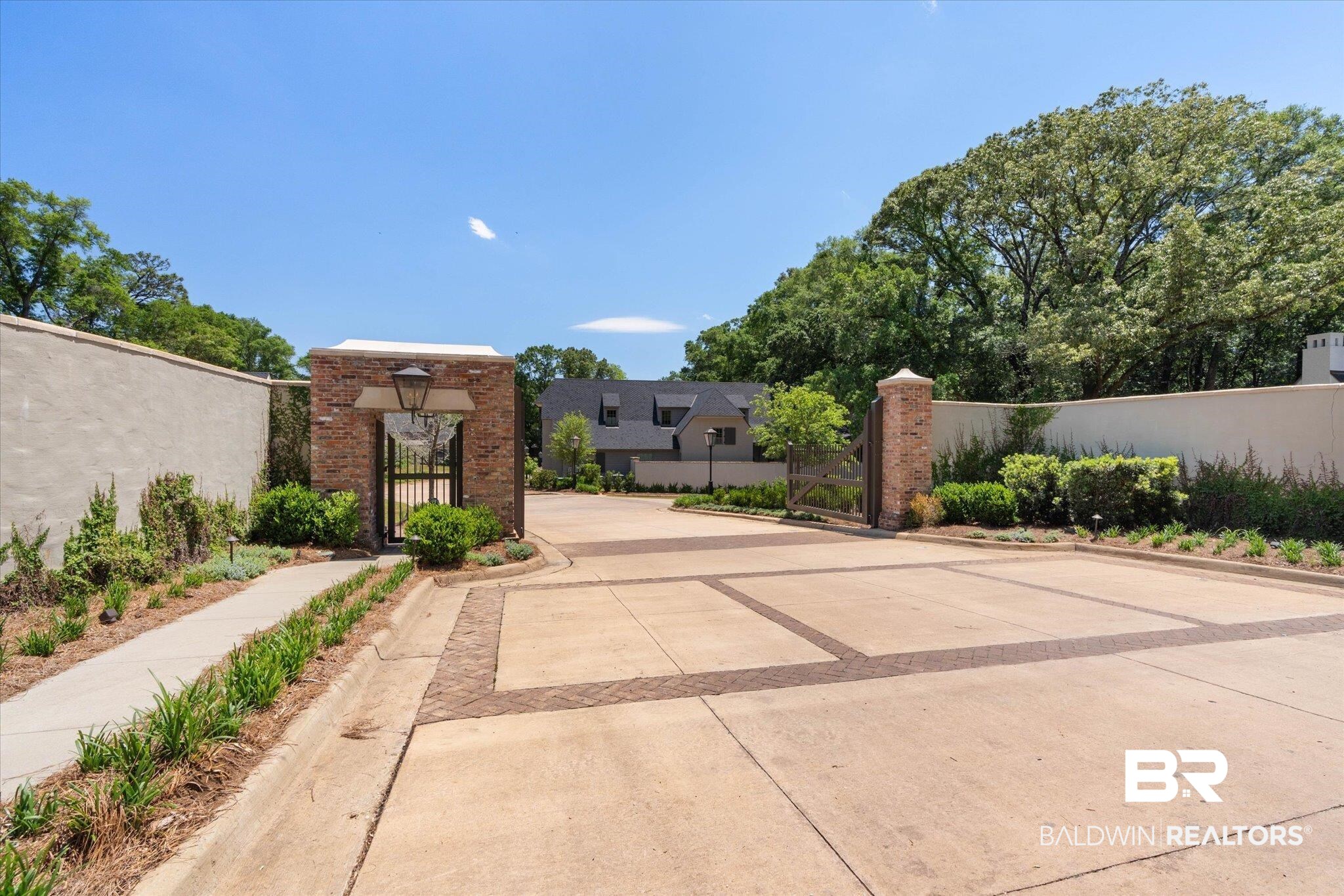 3 Canterbury Park Mobile, AL 36608 - Photo 34 of 43 View of concrete road with a gate, curbs, a gated entry, and sidewalks