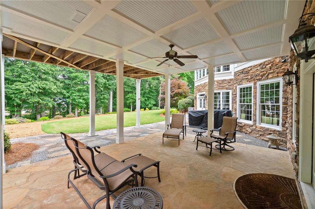322 Edwards Brook Lane Canton, GA 30115 - Photo 92 of 99 a view of a patio with a table chairs and backyard