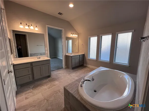 a bathroom with a sink and a bathtub