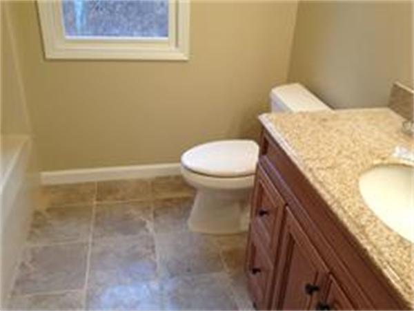 365 Pleasantdale Road Rutland, MA 01543 - Photo 11 of 11 a bathroom with a granite countertop toilet and a sink