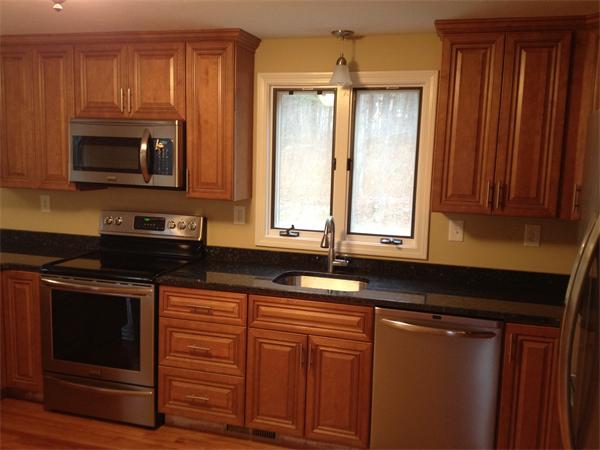 365 Pleasantdale Road Rutland, MA 01543 - Photo 3 of 11 a kitchen with granite countertop cabinets stainless steel appliances a sink and wooden floor