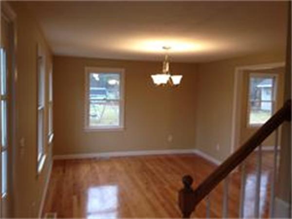 365 Pleasantdale Road Rutland, MA 01543 - Photo 5 of 11 a view of empty room with wooden floor and fan