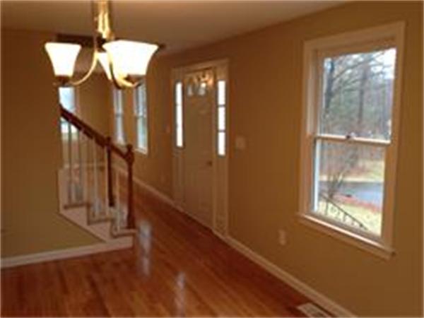 365 Pleasantdale Road Rutland, MA 01543 - Photo 6 of 11 a view of entryway and hall with wooden floor