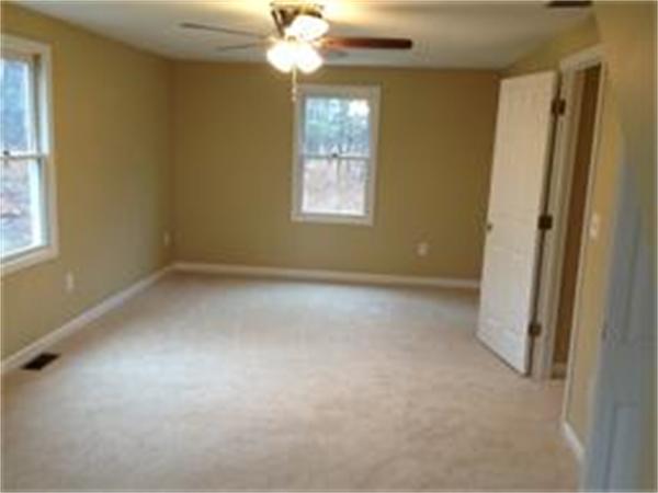 365 Pleasantdale Road Rutland, MA 01543 - Photo 8 of 11 an empty room with a window