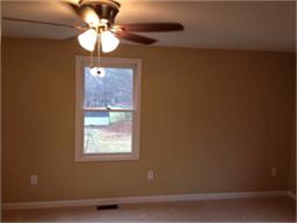 365 Pleasantdale Road Rutland, MA 01543 - Photo 9 of 11 a view of a chandelier fan and fire place