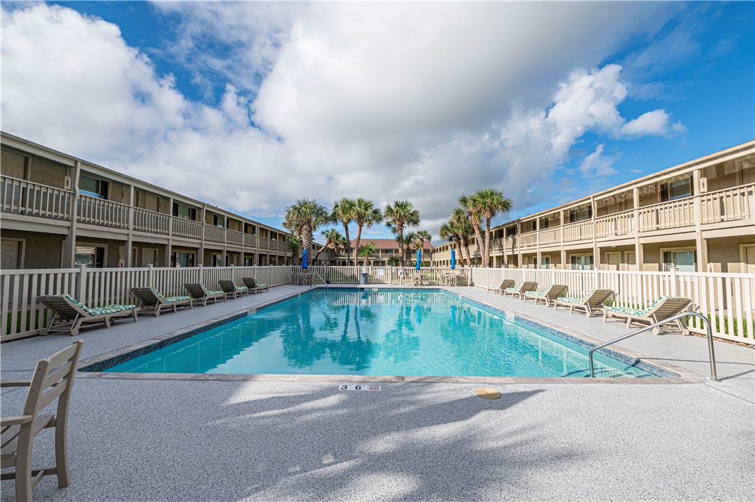 622 Beach Access Road Port Aransas, TX 78373 - Photo 11 of 19 a view of swimming pool with outdoor seating and deck