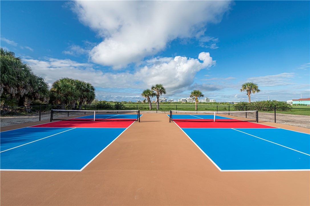 622 Beach Access Road Port Aransas, TX 78373 - Photo 13 of 19 a view of an empty room with wooden floor