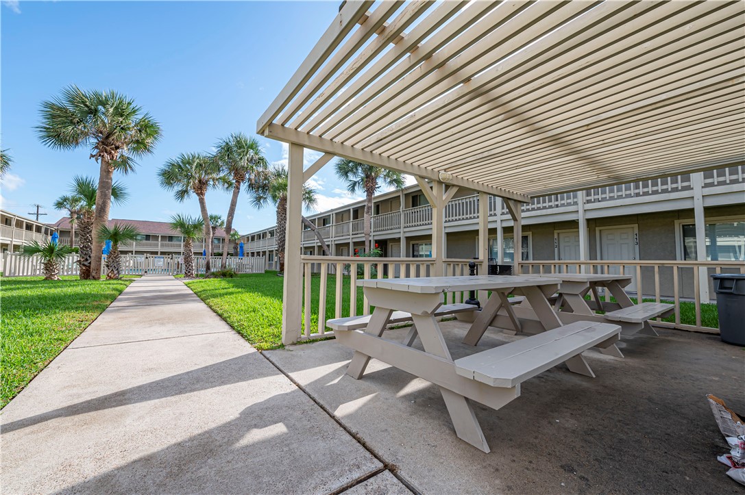 622 Beach Access Road Port Aransas, TX 78373 - Photo 15 of 19 a view of a house with a patio