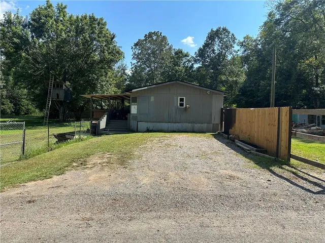 a backyard of a house with lots of green space