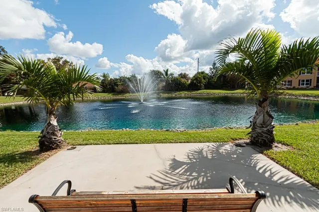 a view of swimming pool with outdoor seating