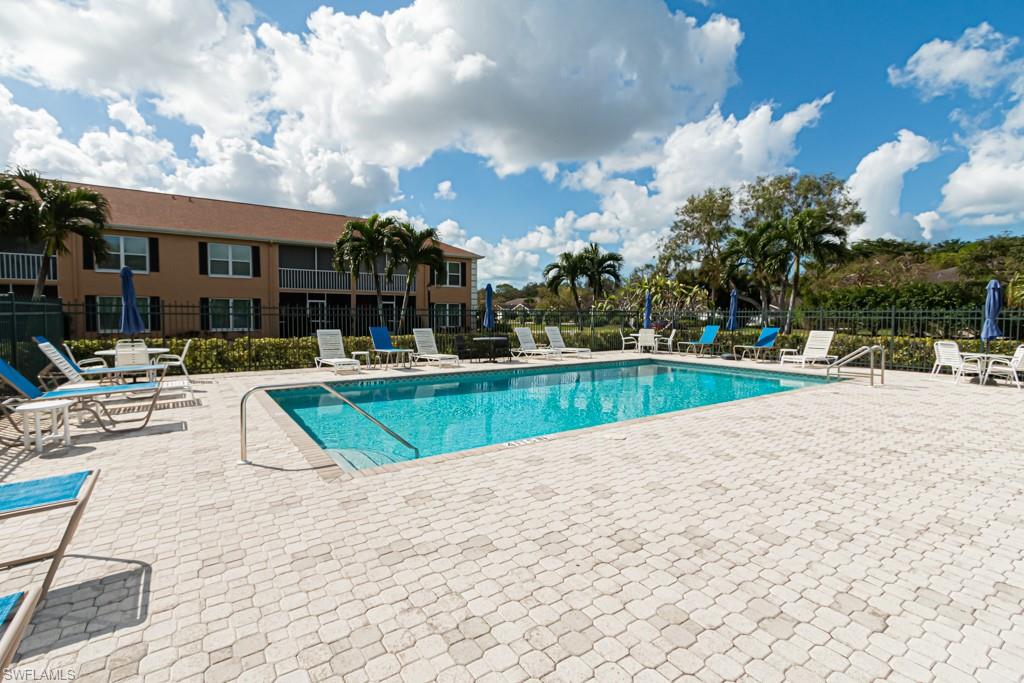 1850 West Crown Pointe Boulevard, Unit A202 Naples, FL 34112 - Photo 43 of 44 a view of swimming pool with outdoor seating