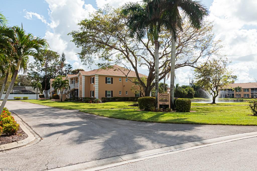 1850 West Crown Pointe Boulevard, Unit A202 Naples, FL 34112 - Photo 44 of 44 a view of a house with garden and trees