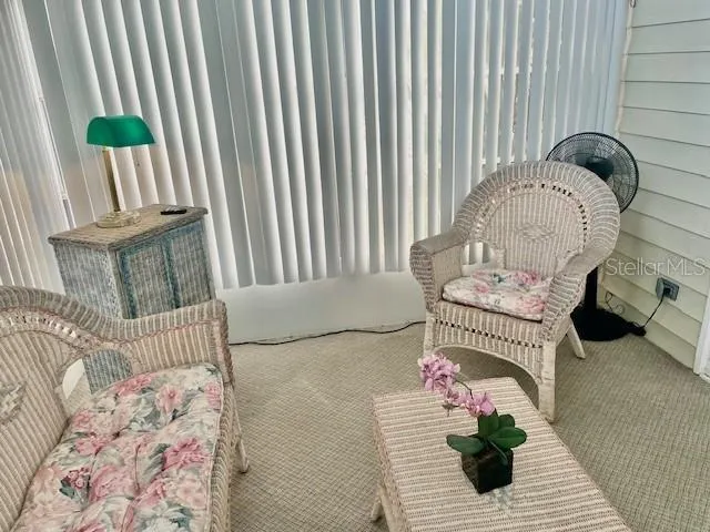 a living room with furniture and a rug