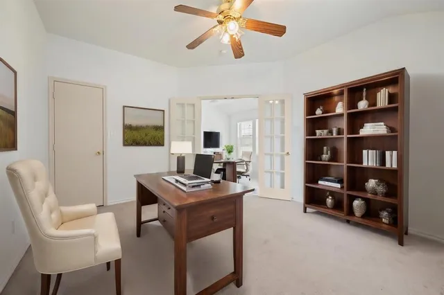 a view of a workspace with furniture and cabinet