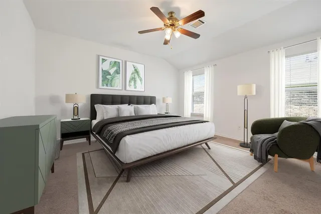 a bedroom with a bed and a window