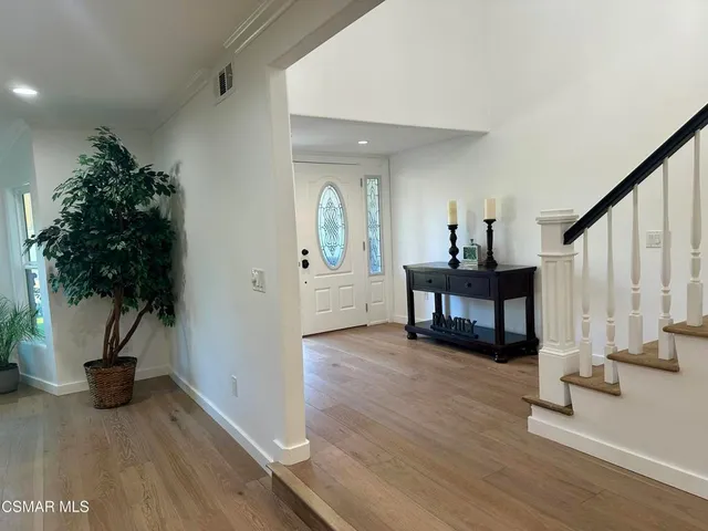 a view of a living room and dining room