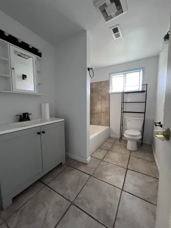 a view of a hallway with wooden shelves