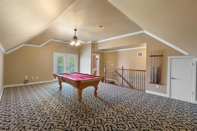 a living room with a rug and a window
