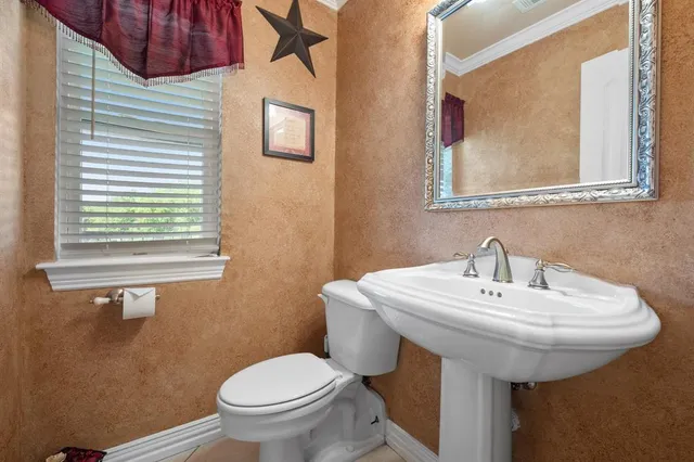 a bathroom with a sink and a toilet