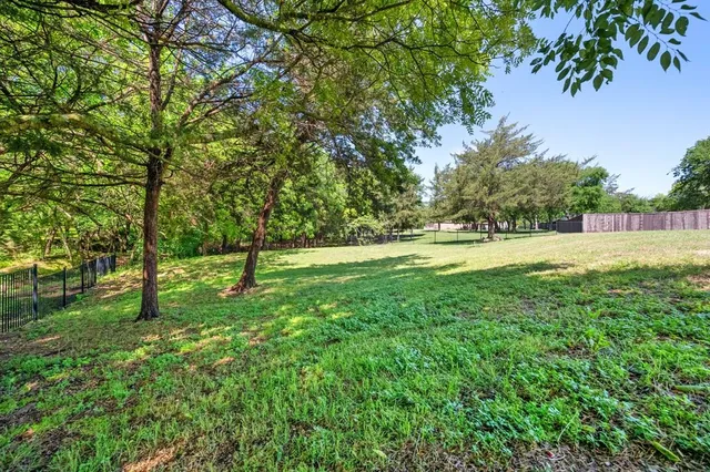 a view of outdoor space with deck and yard