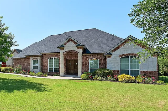 front view of a house with a yard