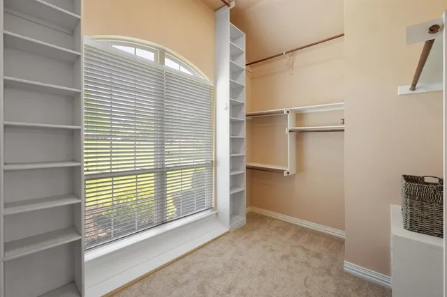 a view of closet area with empty racks
