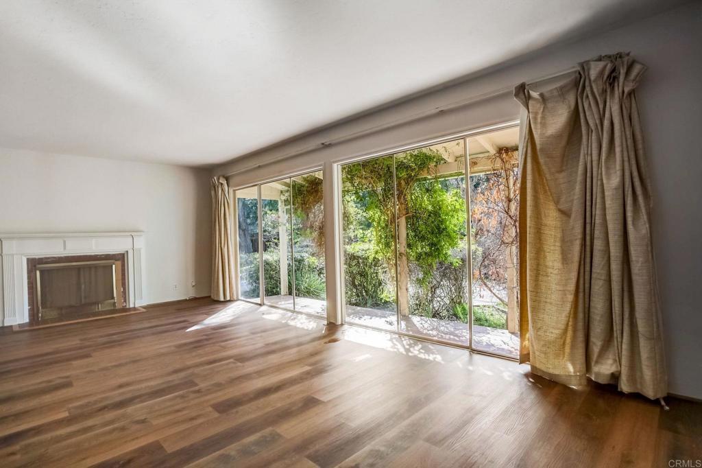 45 Springer Road Los Altos, CA 94024 - Photo 11 of 33 a view of a room with wooden floor and large window
