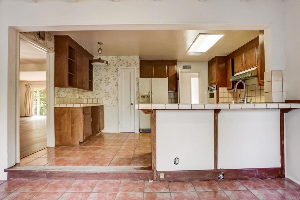 45 Springer Road Los Altos, CA 94024 - Photo 16 of 33 a view of kitchen with kitchen island dining room and wooden floor